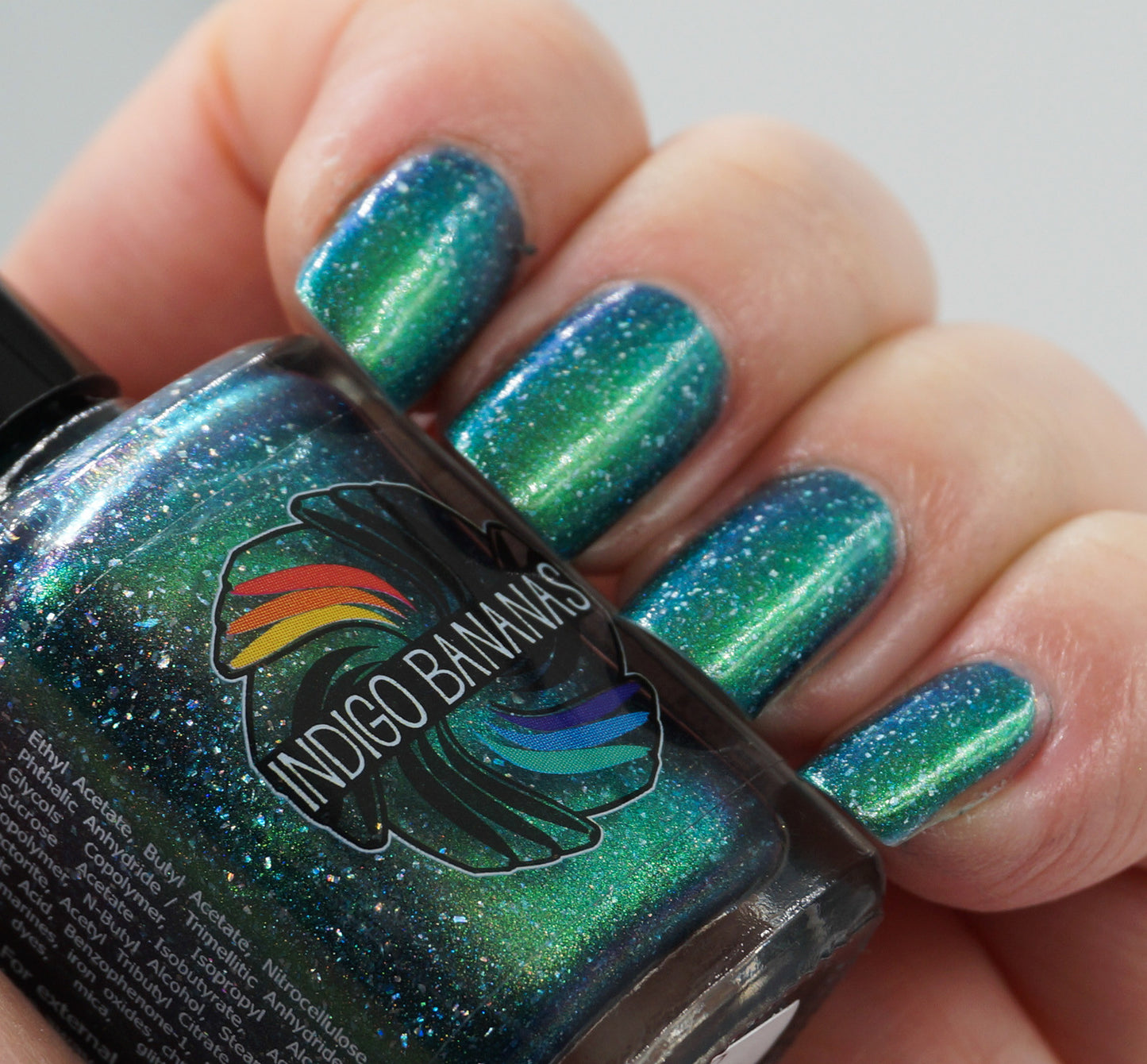 This World Belongs to Us - bright green/blue multichrome linear holographic w/ flakies