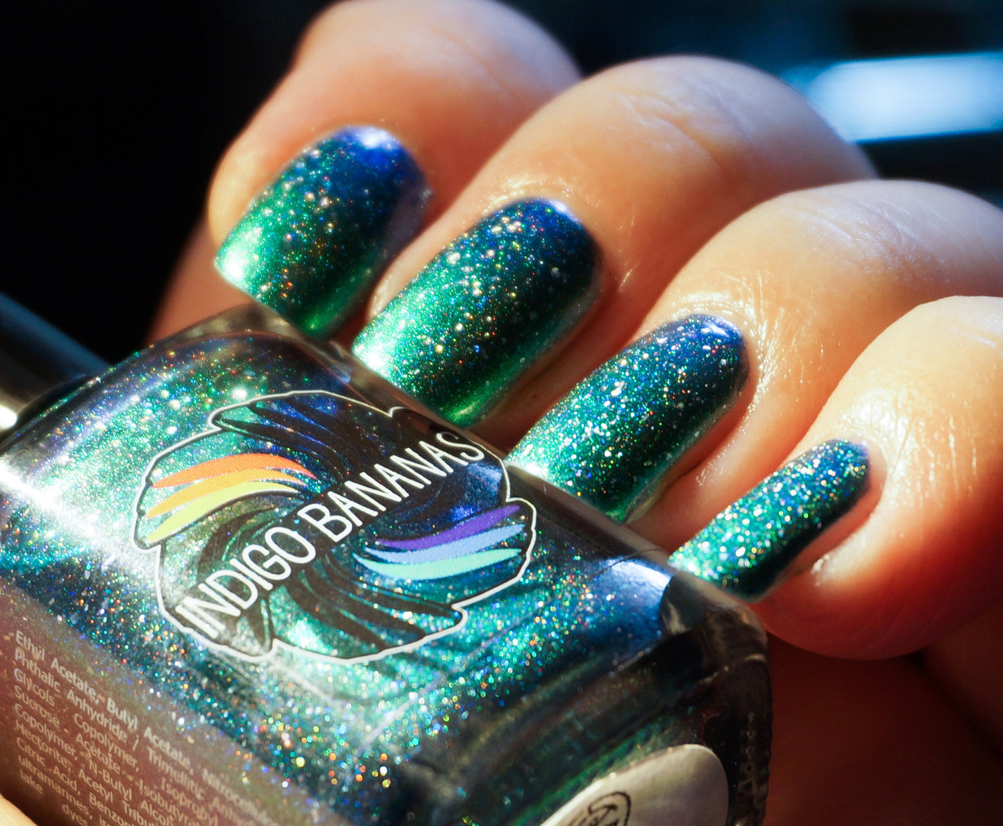 This World Belongs to Us - bright green/blue multichrome linear holographic w/ flakies